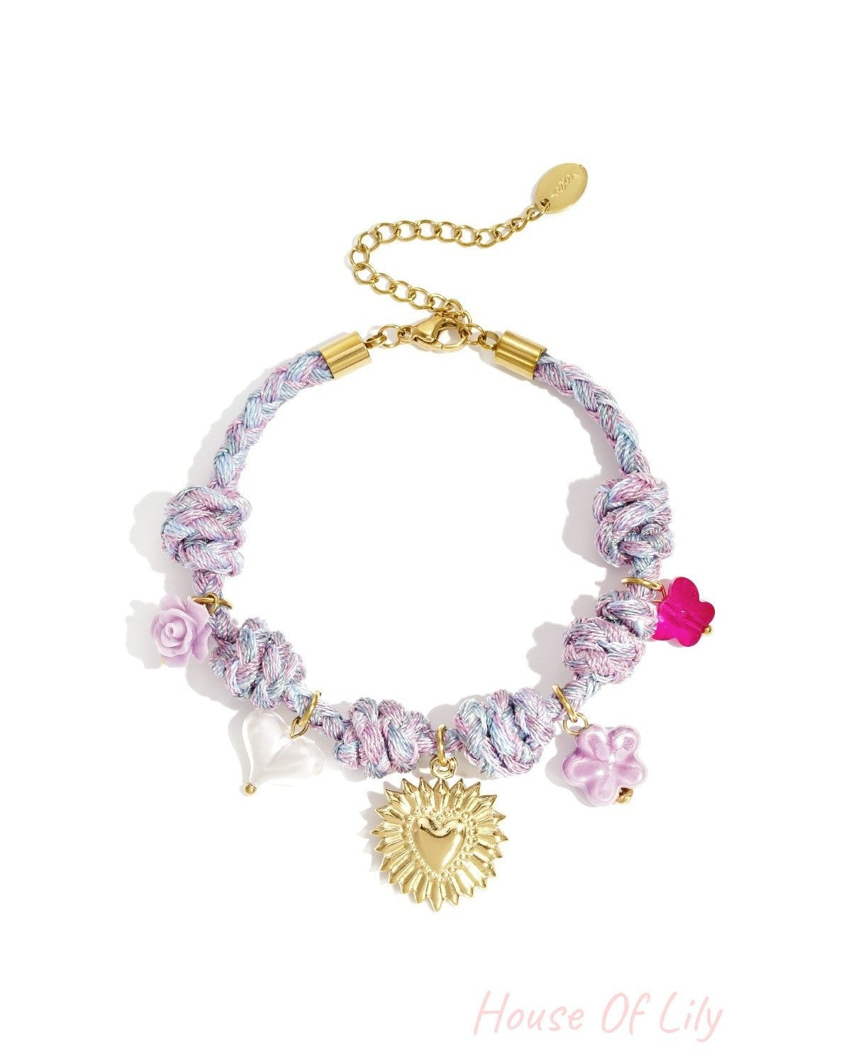 Lavender and blue twisted rope charm bracelet with a gold sunburst heart charm and assorted floral and heart-shaped pastel charms