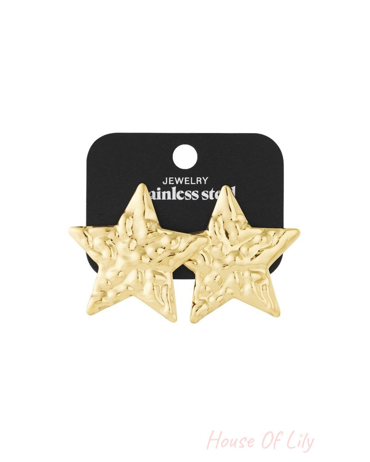 Cosmic Glitch gold-tone star stud earrings with a textured, hammered finish on a black stainless steel display card.
