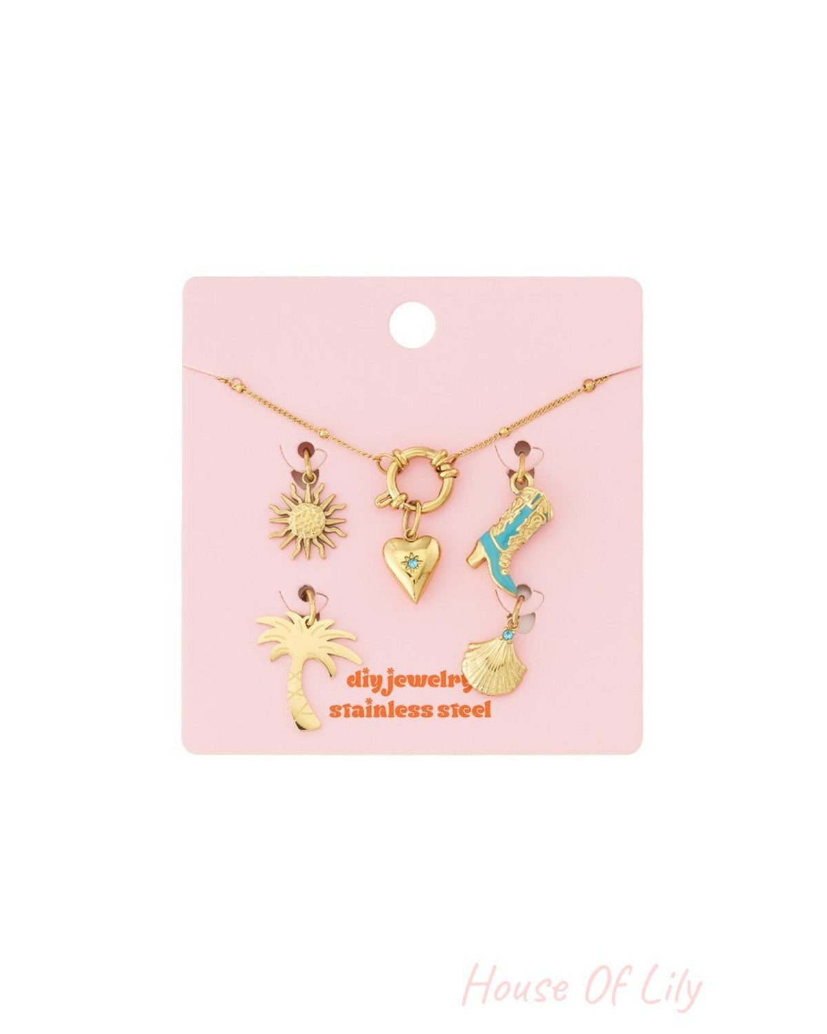 Gold-tone stainless steel chain bracelet kit with heart, sun, cowboy boot, palm tree, and seashell charms on pink card.
