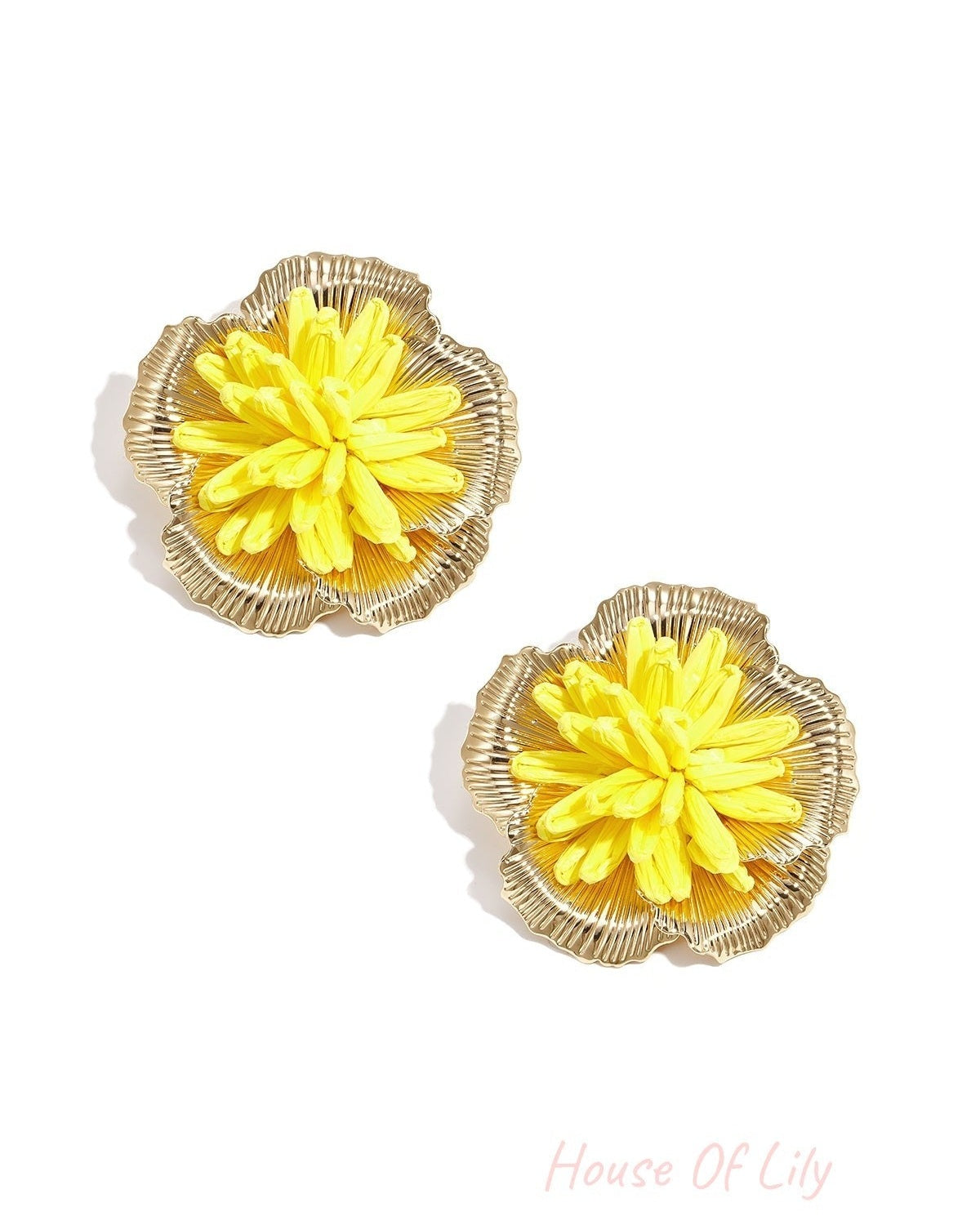Pair of yellow 3D raffia flower stud earrings with gold-tone metal framing on white background