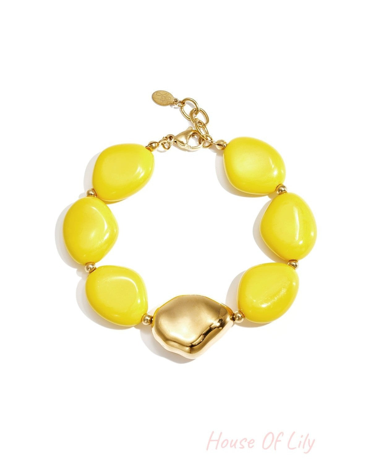 Chunky bracelet with bright yellow irregular acrylic beads and gold-tone clasp and centerpiece