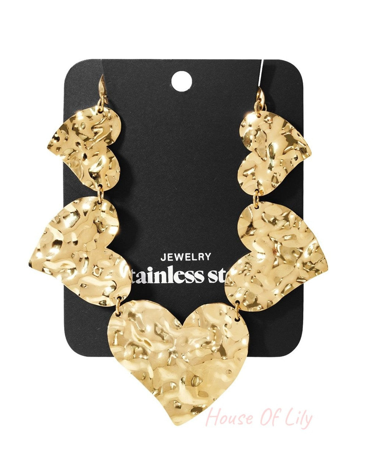 Gold-tone stainless steel drop earrings featuring multiple linked, hammered-texture heart shapes on a display card.