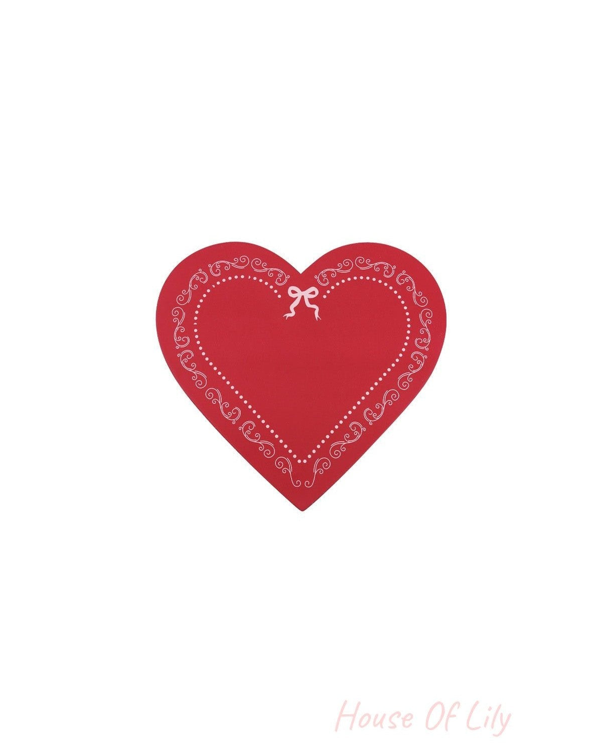 Red heart-shaped box lid decorated with white swirls and bow pattern