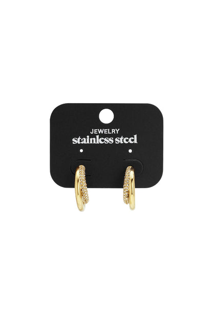 Gold-tone Y2K hoop earrings featuring a smooth metal band layered with a pavé-style crystal band on a display card.