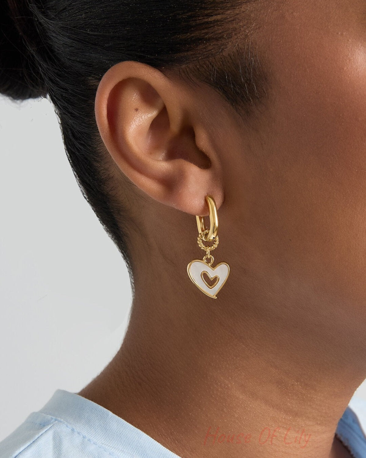 Squoval earrings with dangling mother-of-pearl hearts