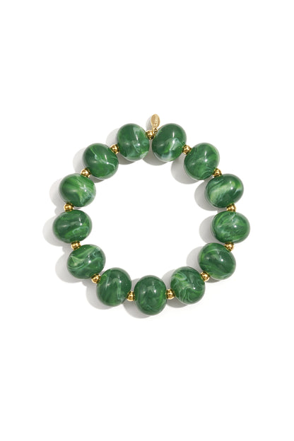 Green marbled beaded stretch bracelet detailed view with gold accent beads on white background