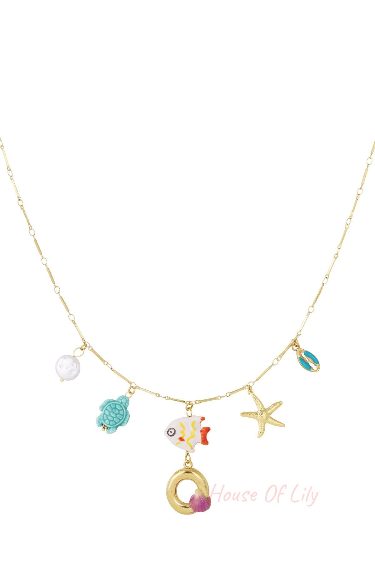 Gold chain necklace with colorful nautical charms: sea turtle, fish, starfish, seashell, and a gold letter 'O' pendant.