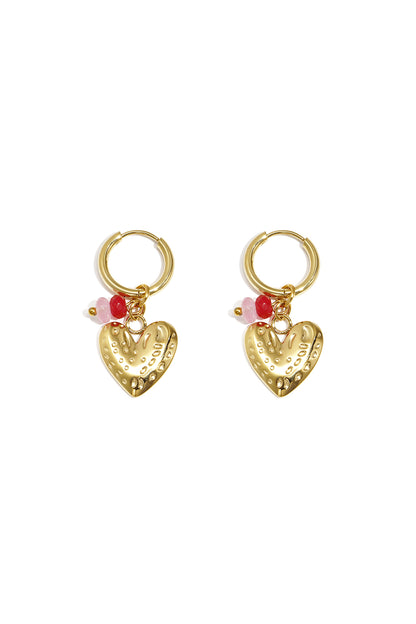 Pair of gold hoop earrings with textured heart pendants and pink and red bead accents displayed on white background