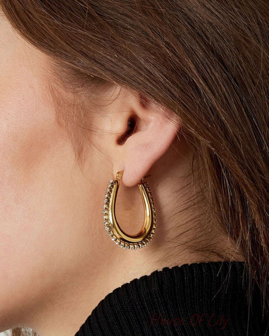 drop shaped earrings with stones