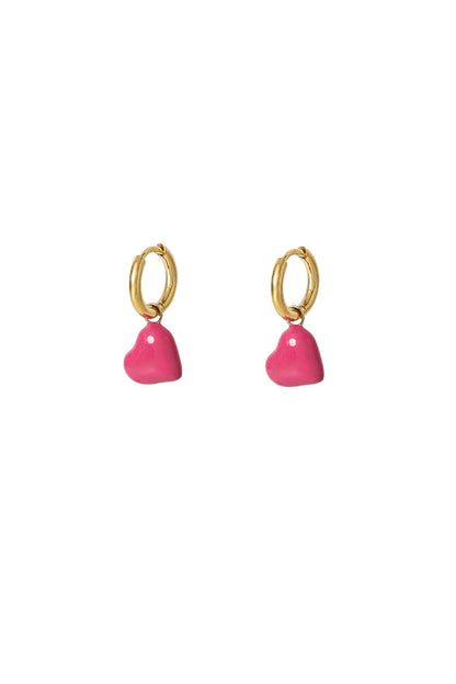 Pair of gold hoop earrings with bright pink enamel hearts displayed on white background
