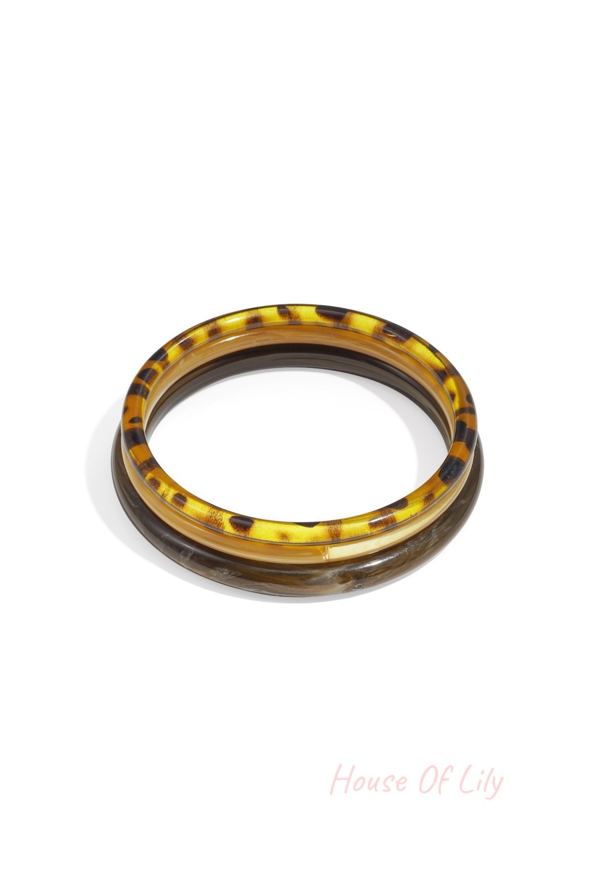 Set of three resin bangles with tortoise shell and brown marbled designs on white background