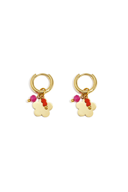 Pair of gold-plated hoop earrings with flower-shaped charm and pink-red beads on white background