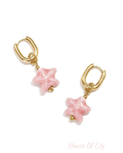 Squoval earrings with colored star pendant