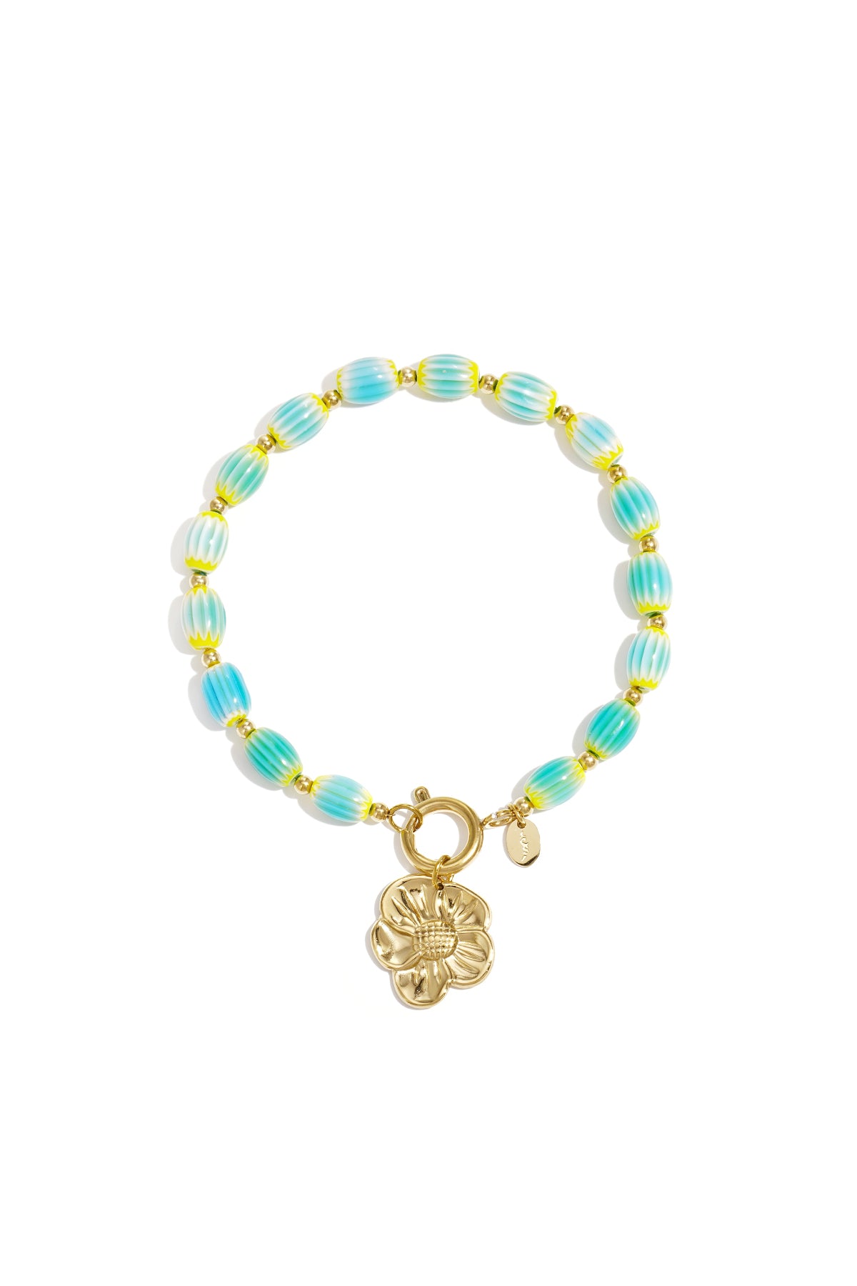Turquoise and yellow striped beaded bracelet with gold-tone flower charm on white background