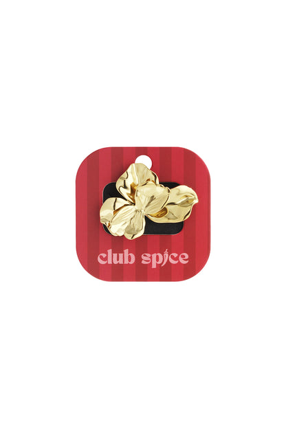 Bloom Power Ring: A shiny gold statement ring shaped like an organic, blooming flower on a red branded display card.
