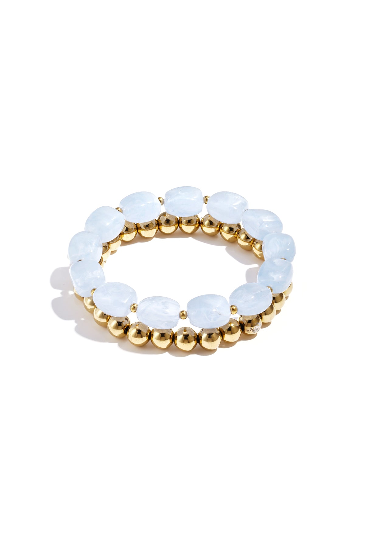 Mint green marbled acrylic beaded bracelet with shiny gold-tone beaded bracelet on white background