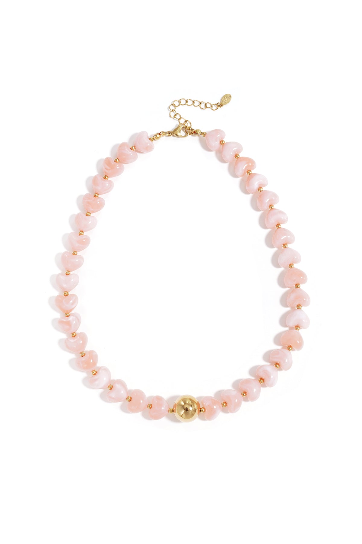 Close-up image of a heart-shaped beaded necklace in soft pink with a gold-tone round bead and adjustable clasp on white background