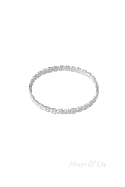 Silver floral detail bangle bracelet with delicate flower pattern