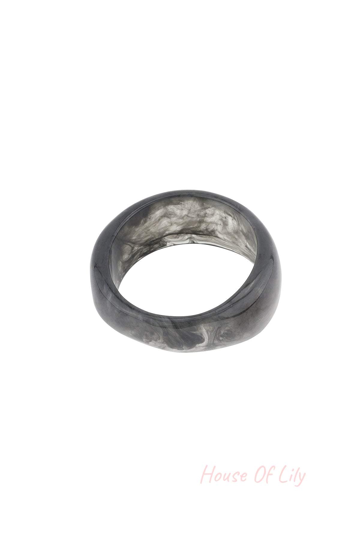 Close-up of smoky gray marbled resin bangle bracelet on white background