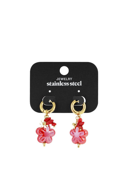 Gold stainless steel hoop earrings featuring pink flower charms, red bead accents, and a small metal flower charm.