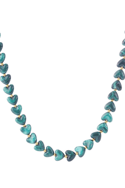 Dark brown marbled heart bead necklace with gold spacers on white background