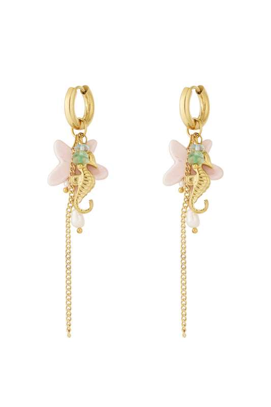 Pair of gold-tone hoop dangle earrings featuring a seahorse charm, pink starfish, pearl drops, and a delicate chain.