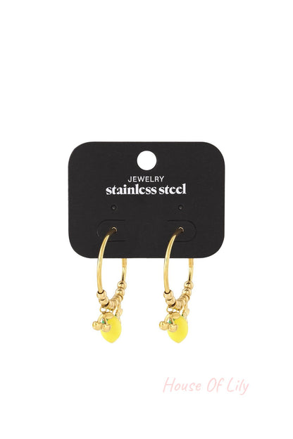 Gold earrings with yellow accents on a black jewelry card with 'stainless steel' text.
