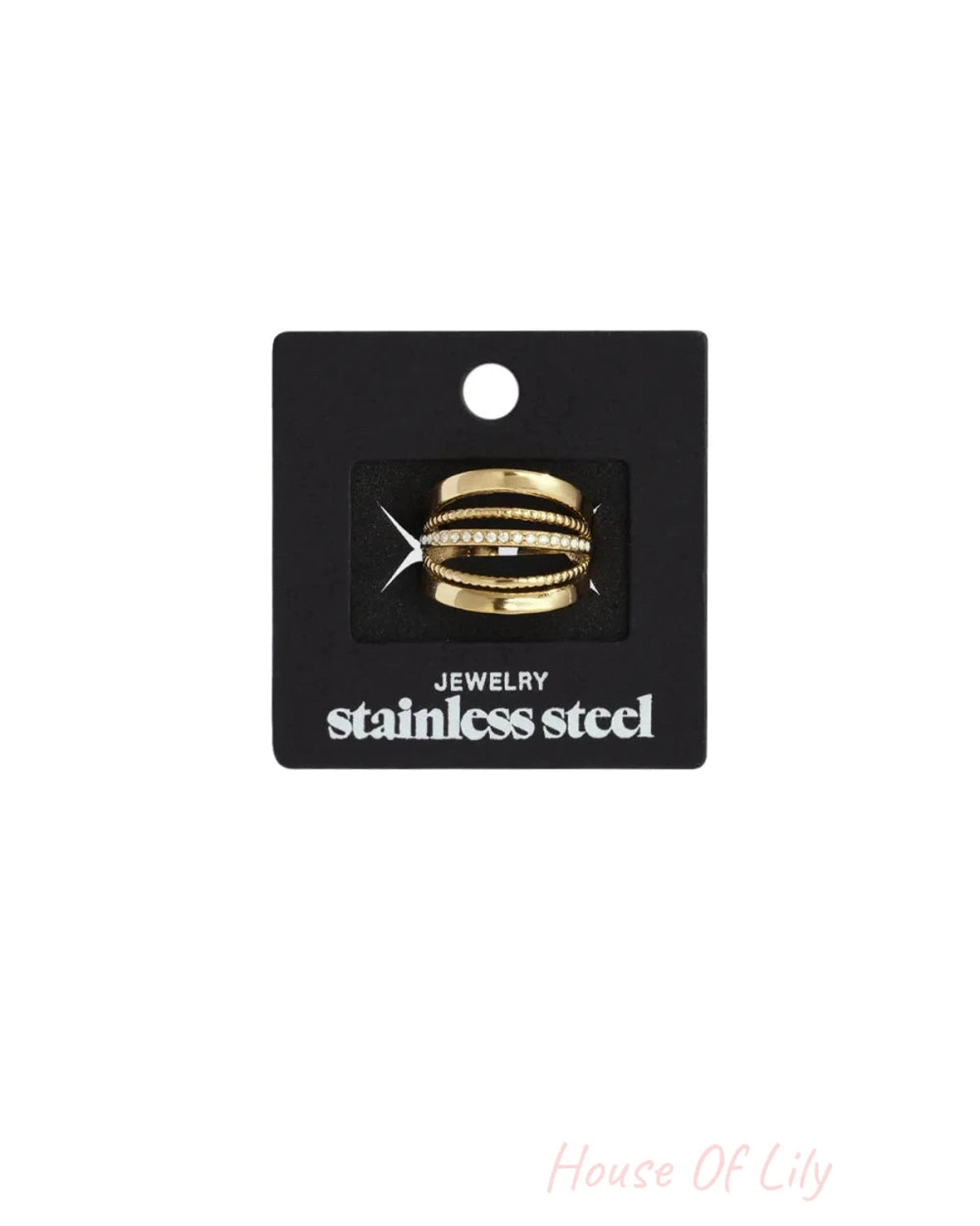 Gold stainless steel multi-band ring with a crystal-embedded center band, displayed on black carding.