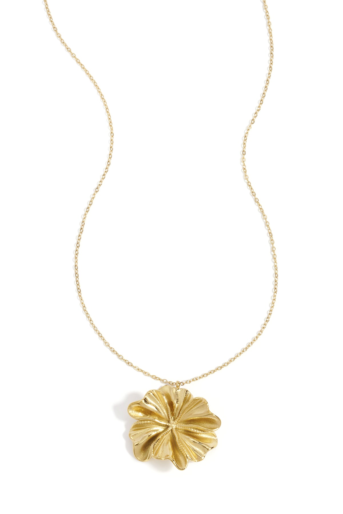 Gold flower-shaped pendant necklace with delicate chain on white background