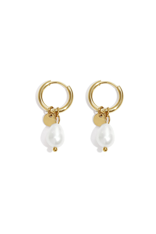 Pair of gold hoop earrings with dangling irregular-shaped white pearls and small gold discs on white background
