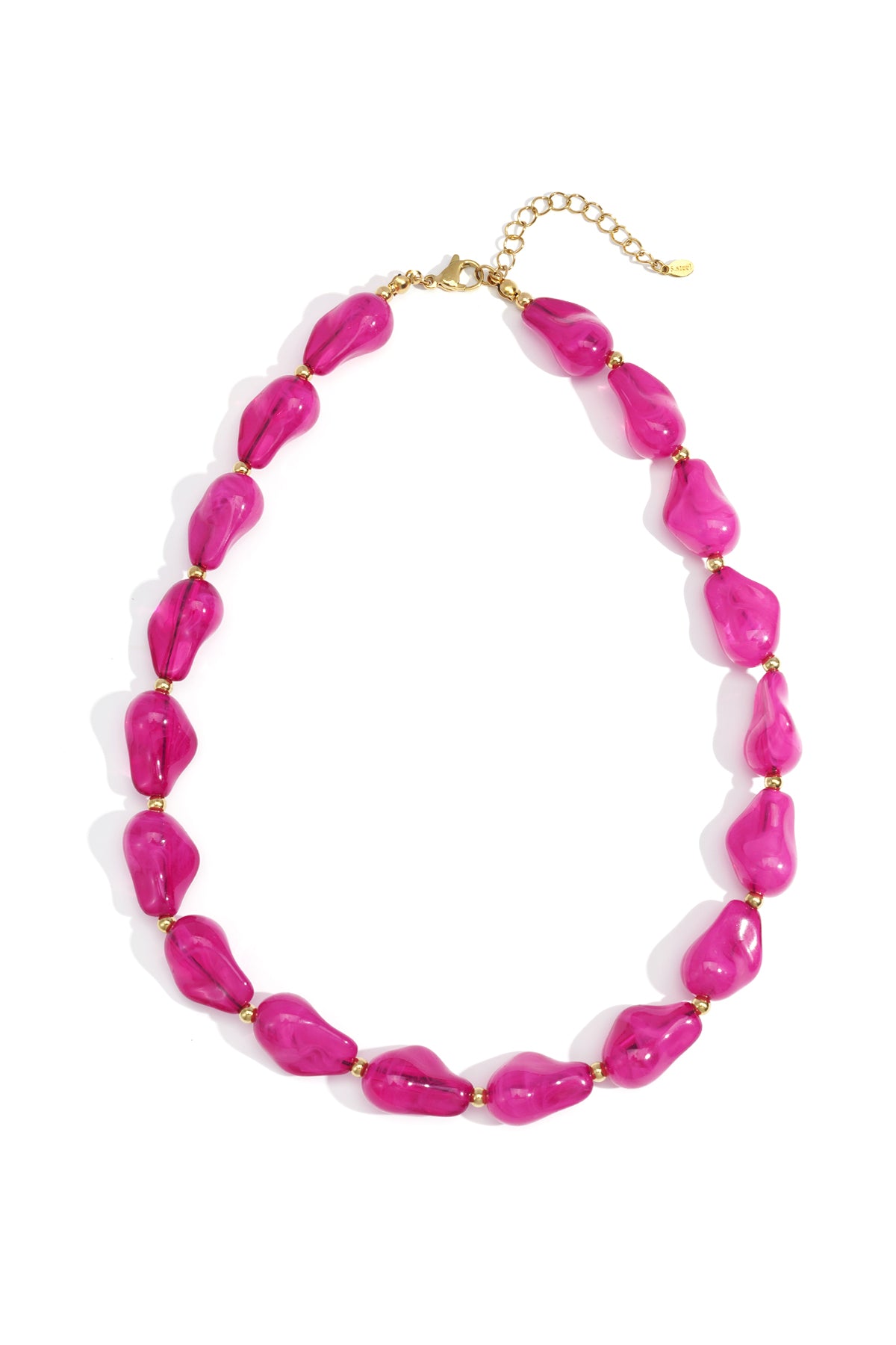 Vibrant pink acrylic statement beaded necklace with gold-tone spacer beads and adjustable clasp laid flat