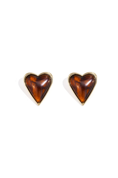 Pair of retro heart-shaped stud earrings with amber acrylic center and gold alloy border on white background