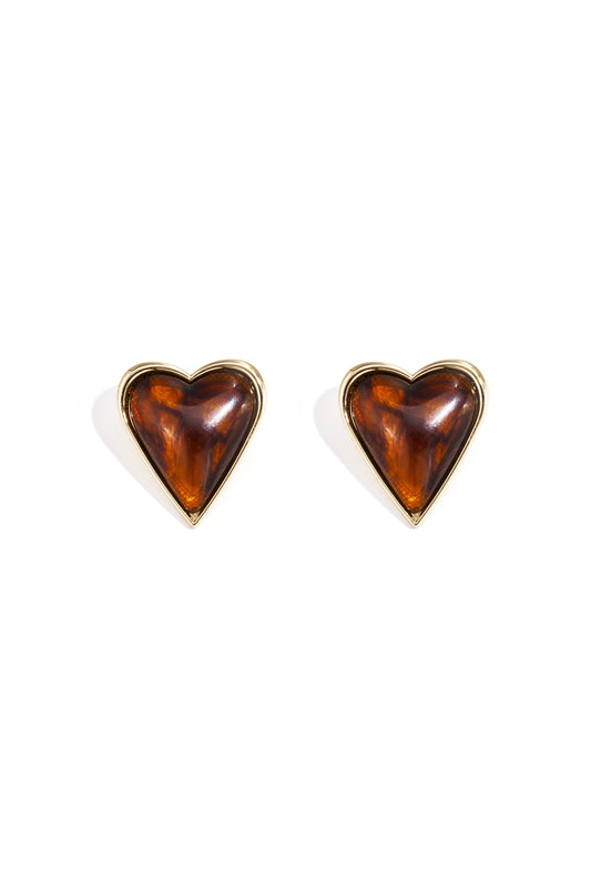 Pair of retro heart-shaped stud earrings with amber acrylic center and gold alloy border on white background
