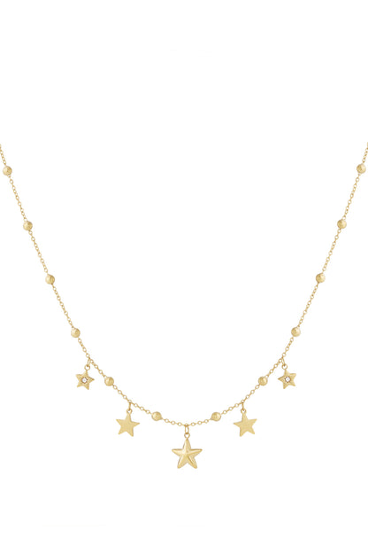 Gold star charm pendant necklace with small beads on chain, isolated on white background