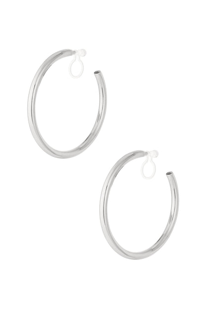 Pair of classic minimal silver clip-on hoop earrings isolated on white background
