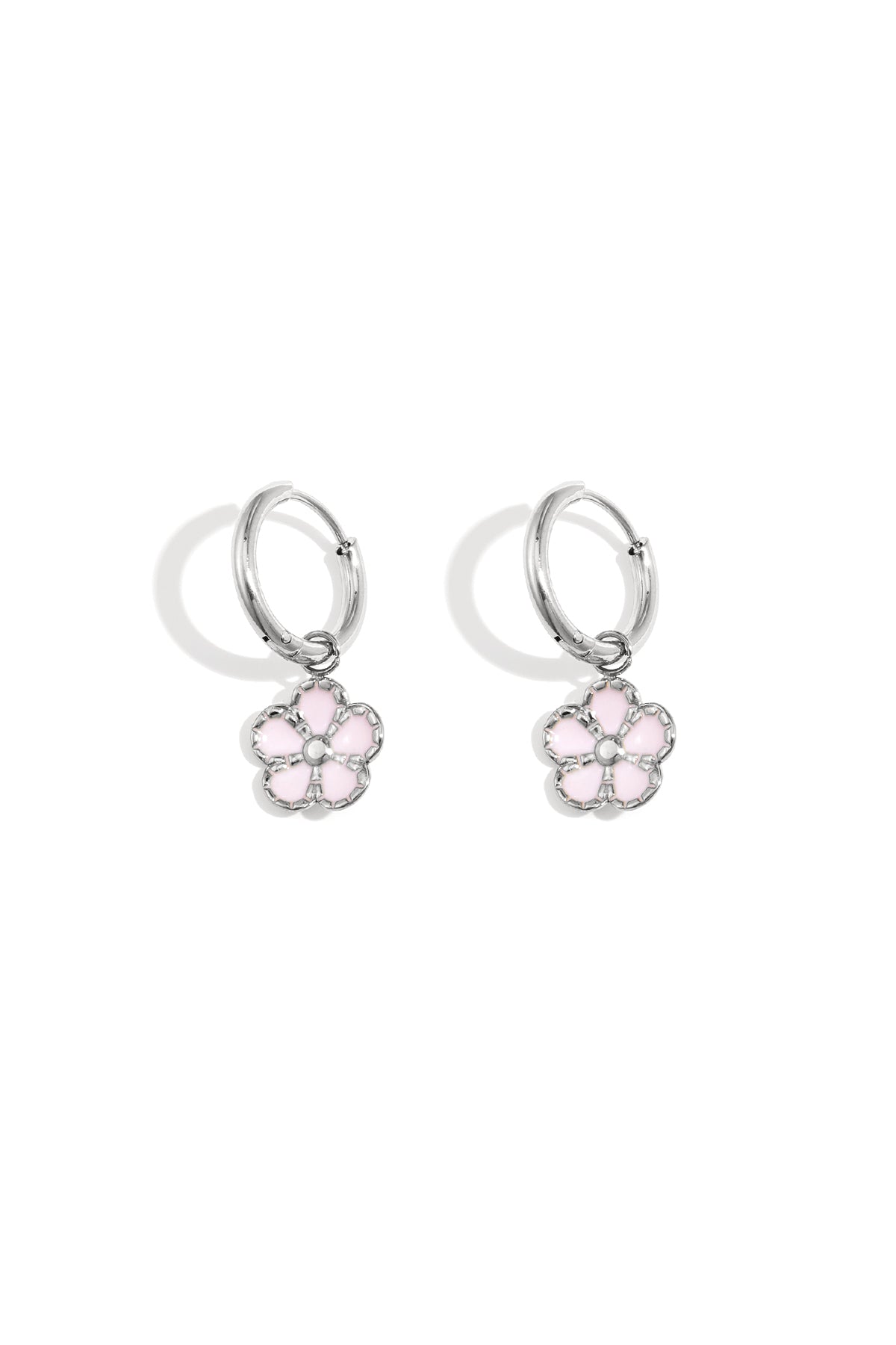 Pair of silver hoop earrings with delicate pink enamel flower charms displayed on a white background