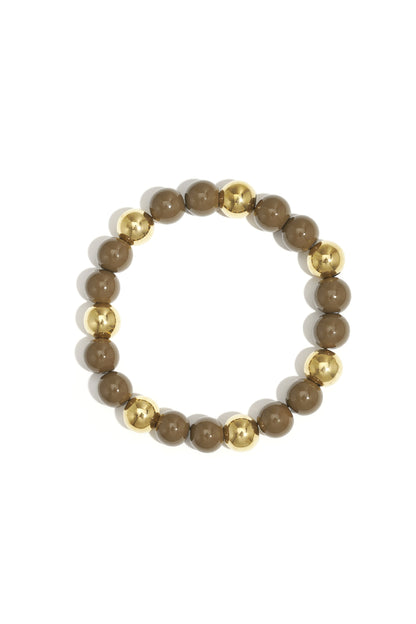 Single acrylic beaded bracelet featuring alternating brown and gold-tone beads isolated on white background