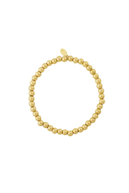 Gold beaded stretch bracelet with polished round beads on a white background