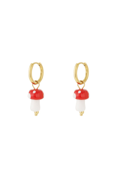 Pair of gold hoop earrings with red and white mushroom enamel charms on white background