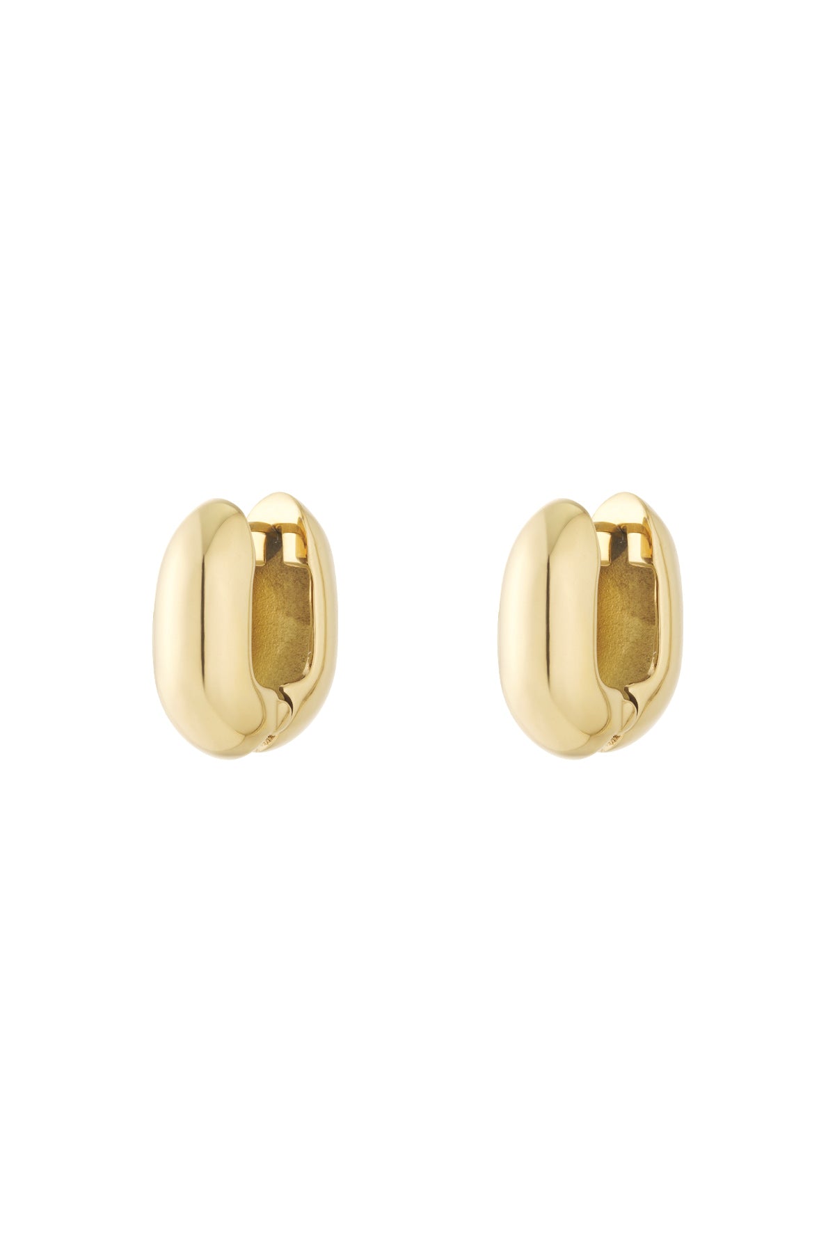 Pair of chunky oval hoop earrings in shiny gold finish isolated on white background