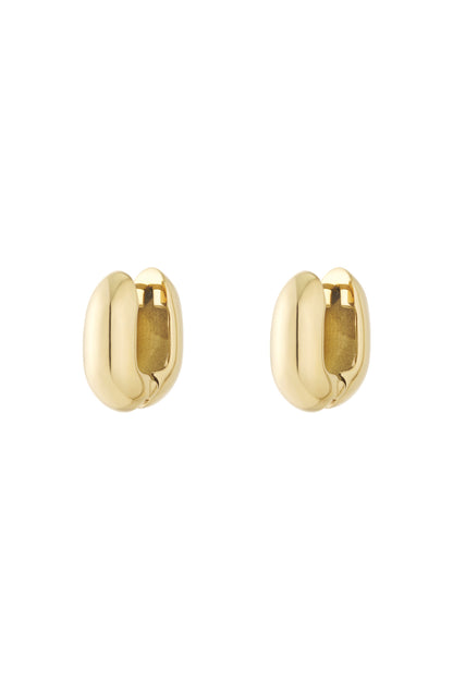 Pair of chunky oval hoop earrings in shiny gold finish isolated on white background