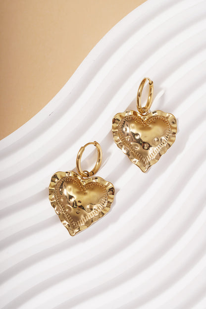 Gold Heart Loop Drop earrings featuring hammered heart charms with ruffled, textured edges on small hoop closures.