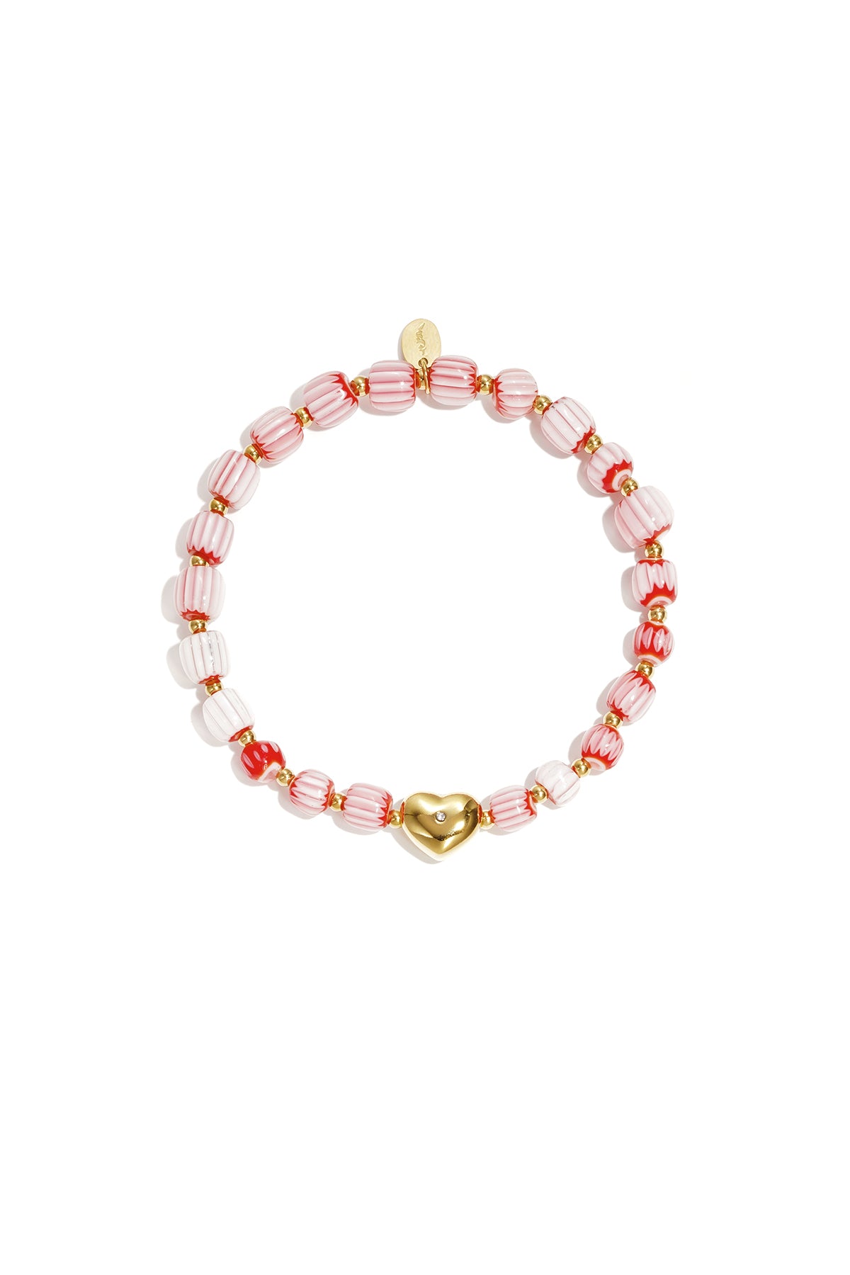 Pink and red striped beaded bracelet with gold heart charm laid flat on white background
