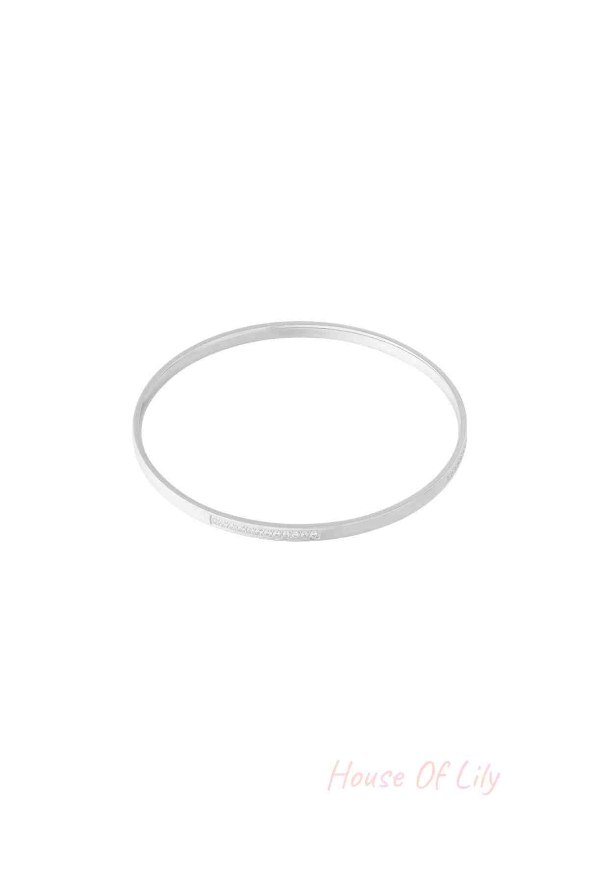 Silver thin rhinestone bangle bracelet isolated on white background