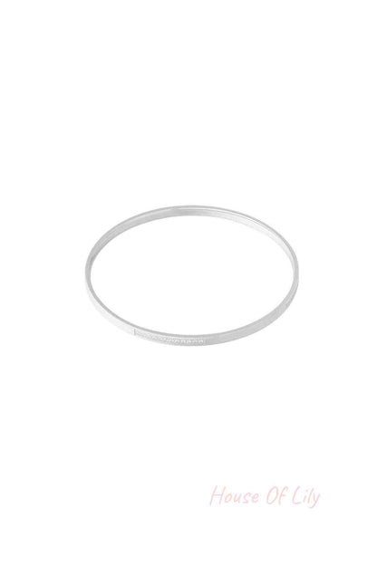 Silver thin rhinestone bangle bracelet isolated on white background