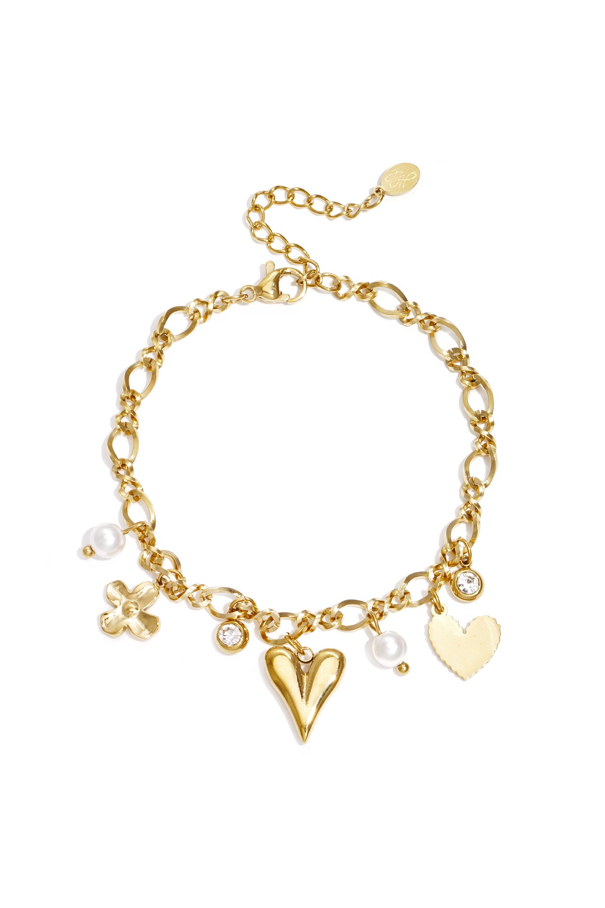 Gold charm bracelet featuring chain links with heart, flower, rhinestone and pearl charms laid flat on white background
