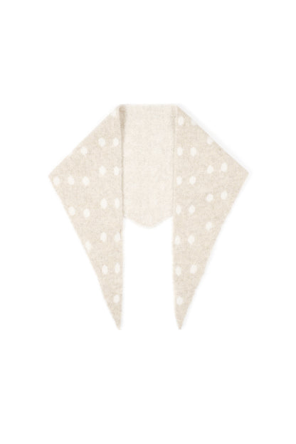Soft knit triangle scarf in beige with white polka dots, displayed flat on white background