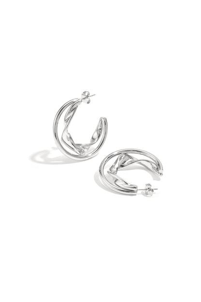 Silver twisted double hoop earrings displayed on white background