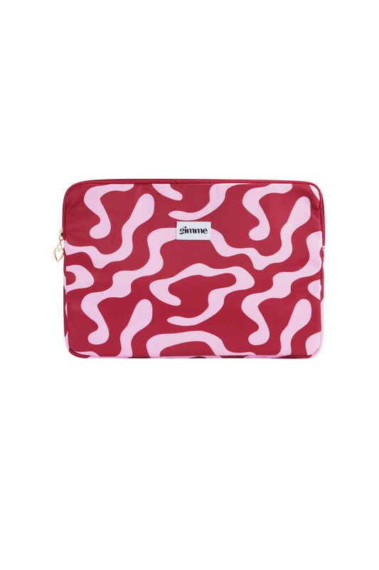 Red and pink wavy patterned laptop sleeve with gimme brand label and heart-shaped zipper pull