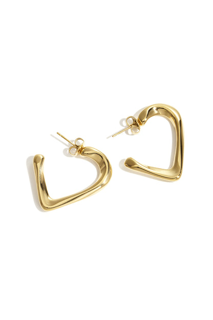Pair of gold heart-shaped hoop earrings with smooth polished finish on white background